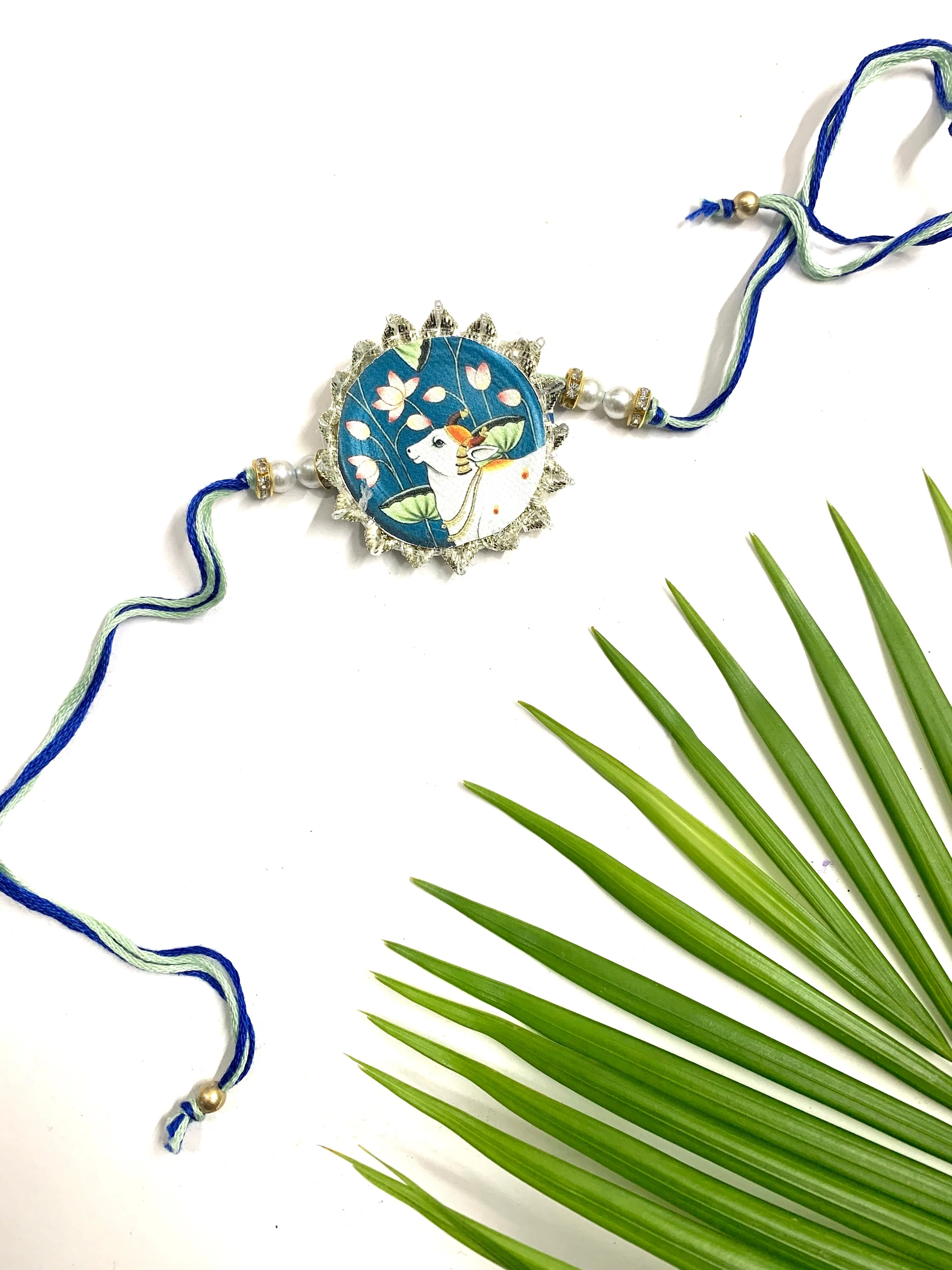 Pichwai Blue Canvas Cow Rakhi