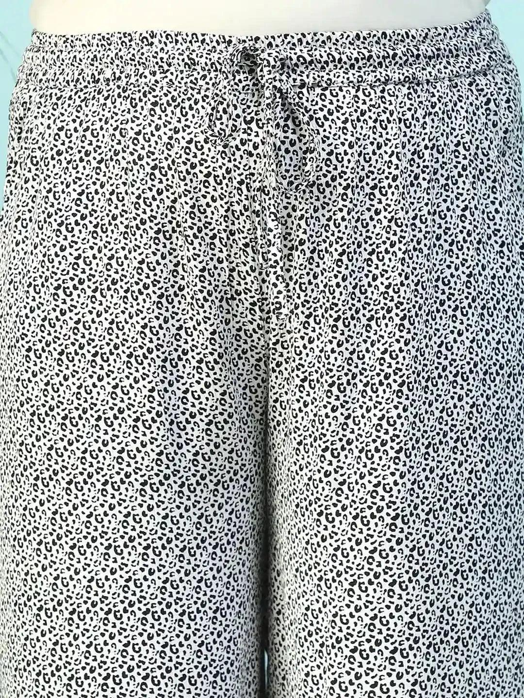 Toned White Animal Print Flared Elasticated Waist With Up Detail Plus Size Women Pant - Image 6